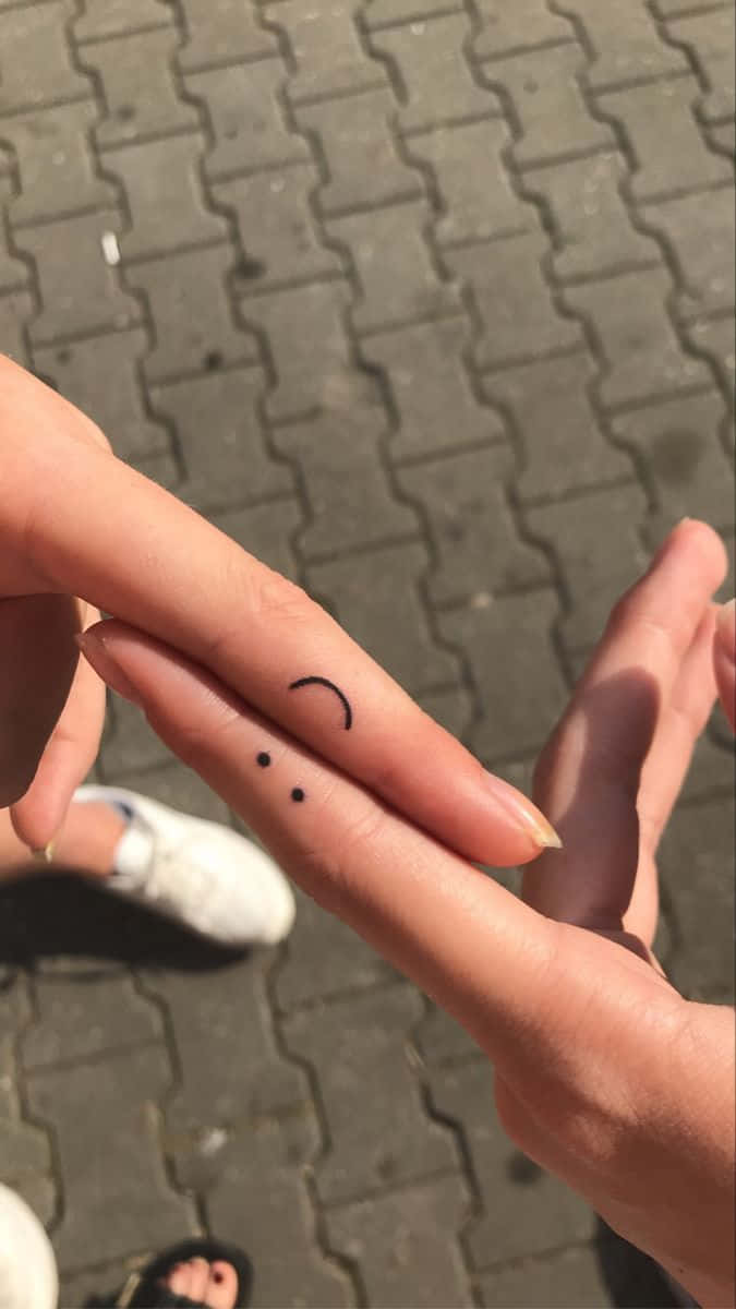 smiley tattoo finger