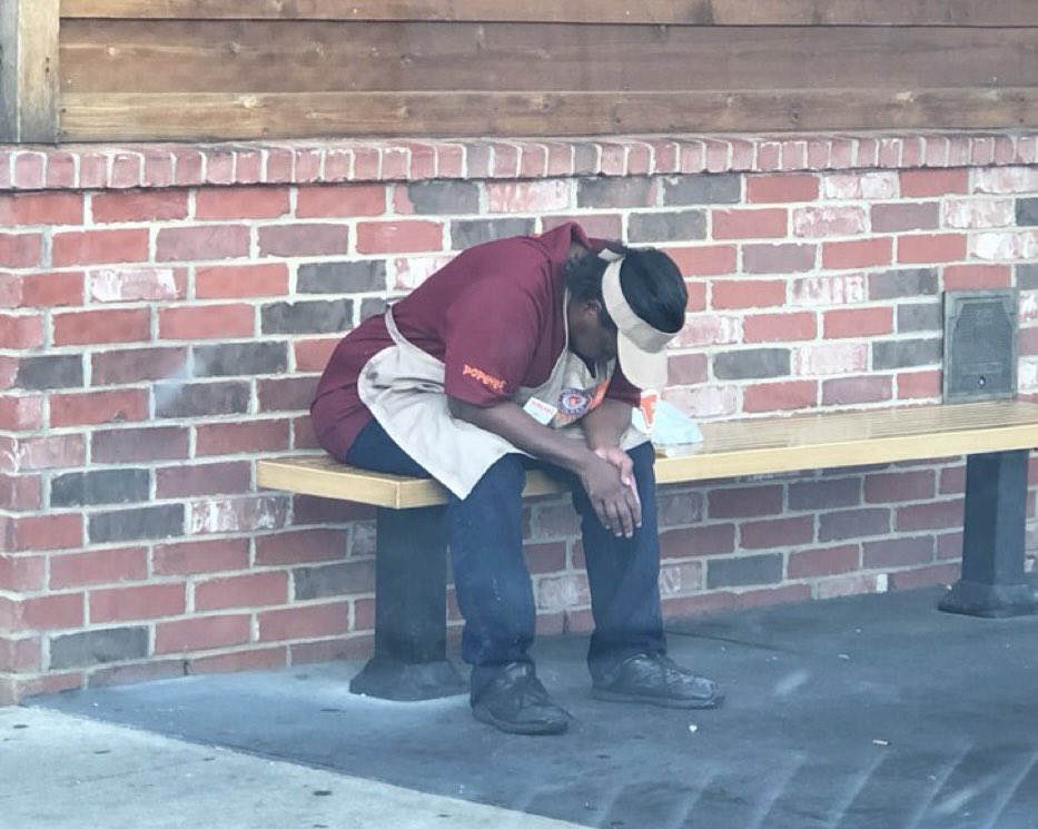 tired popeyes worker