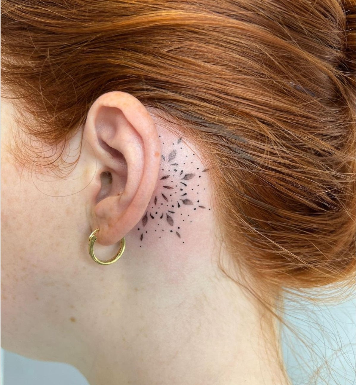 sun ear tattoo
