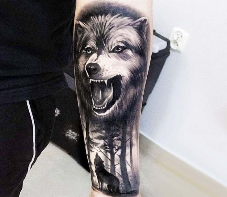 angry lone wolf tattoo