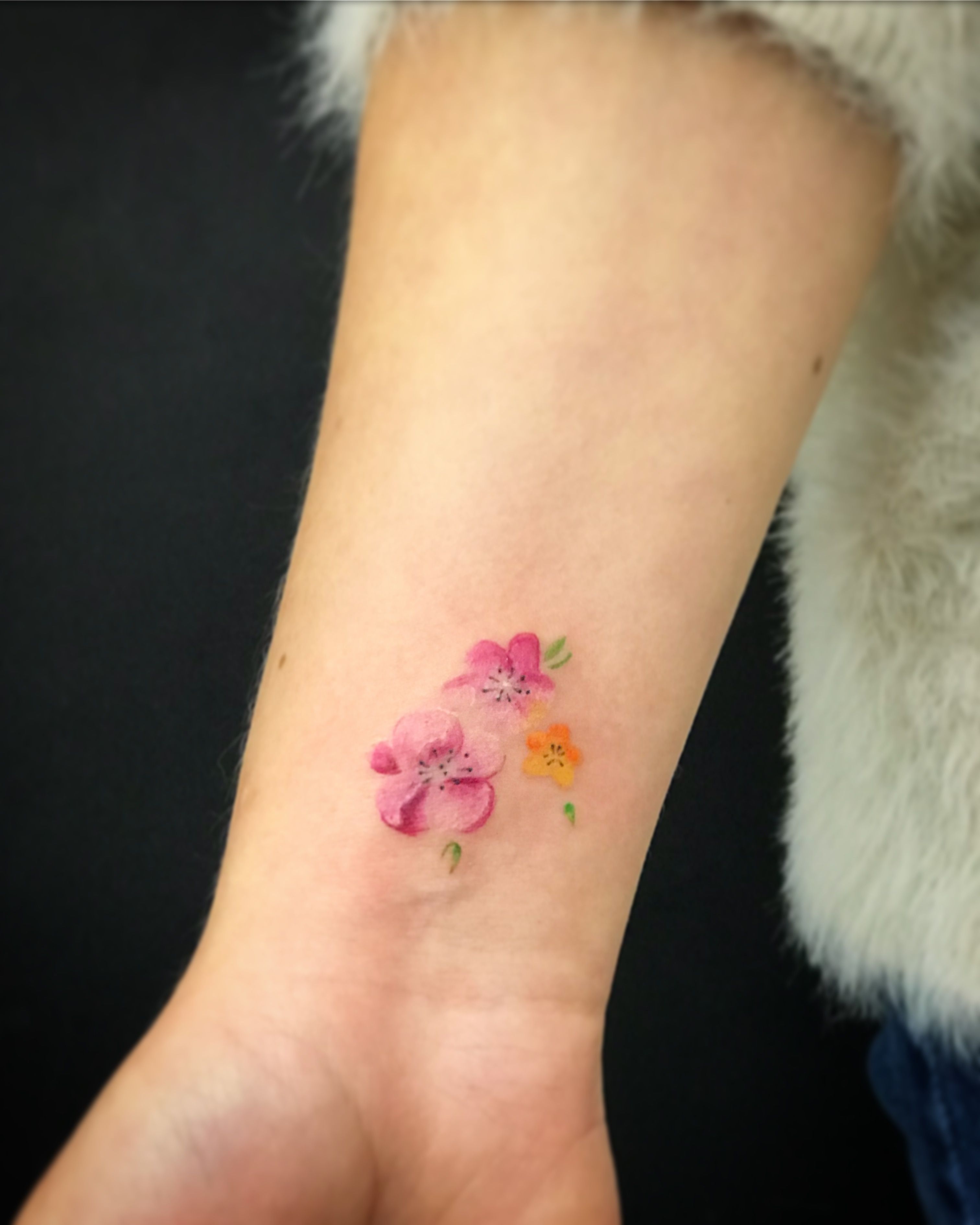 small watercolor flower tattoo