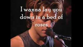 lay me down on a bed of roses song