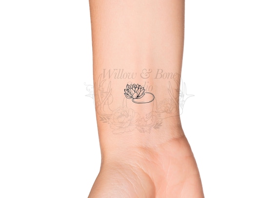 simple water lily tattoo