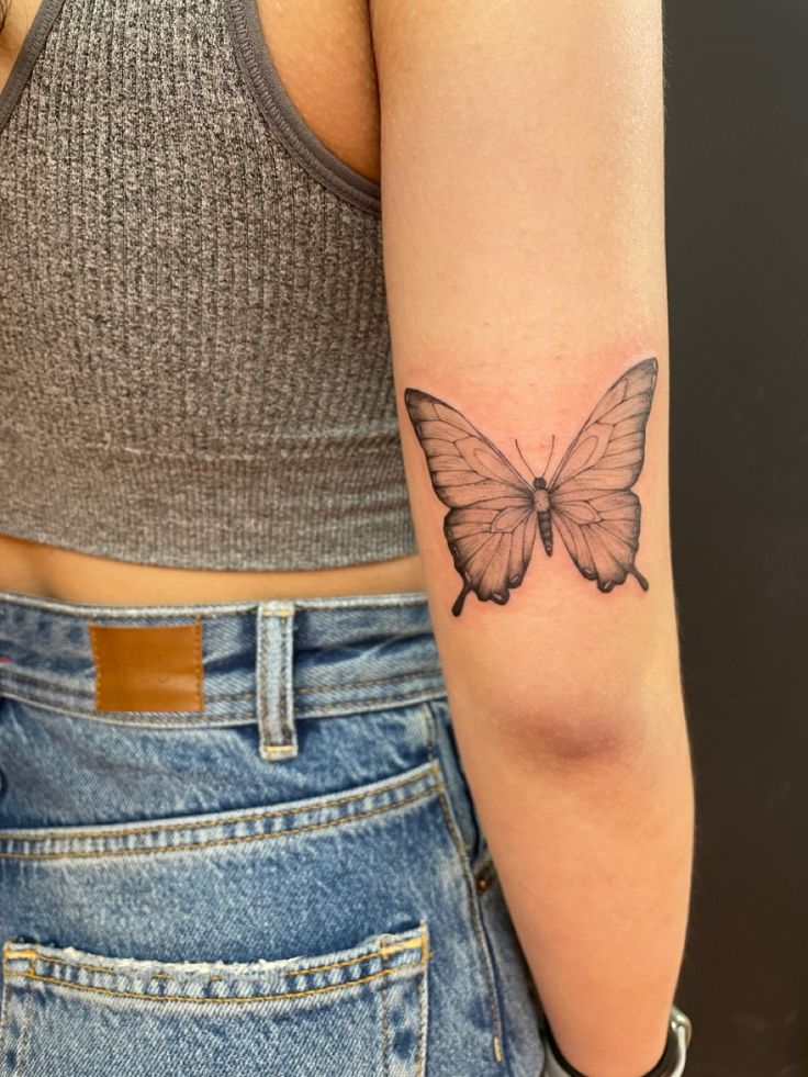 butterfly tattoo on back of elbow