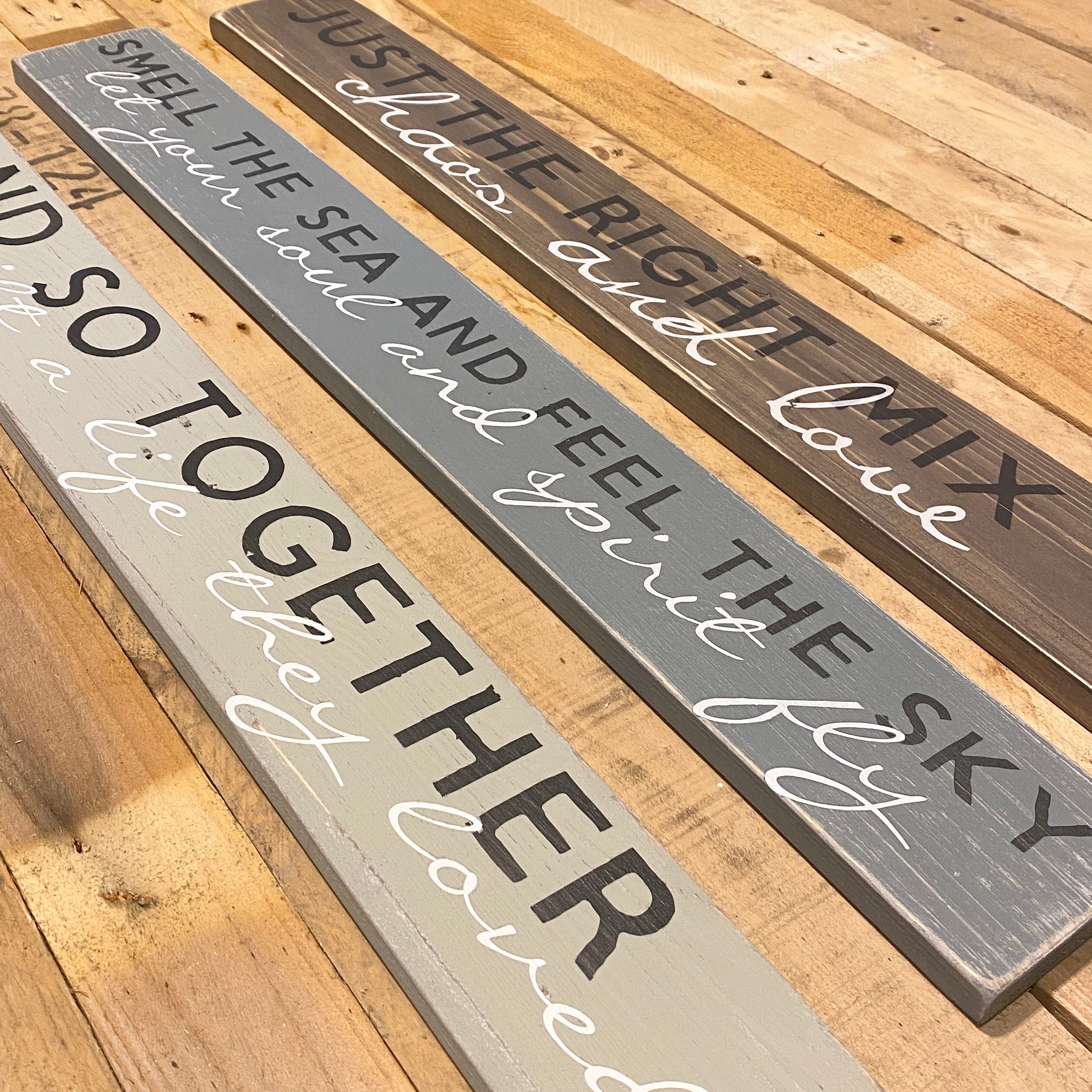 long wooden plaques with quotes