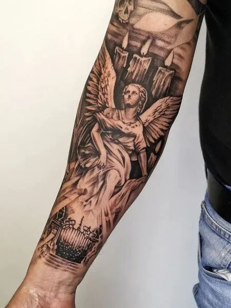 angel on forearm tattoo