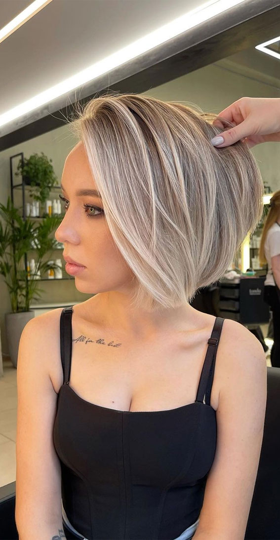 bob cut with blonde highlights