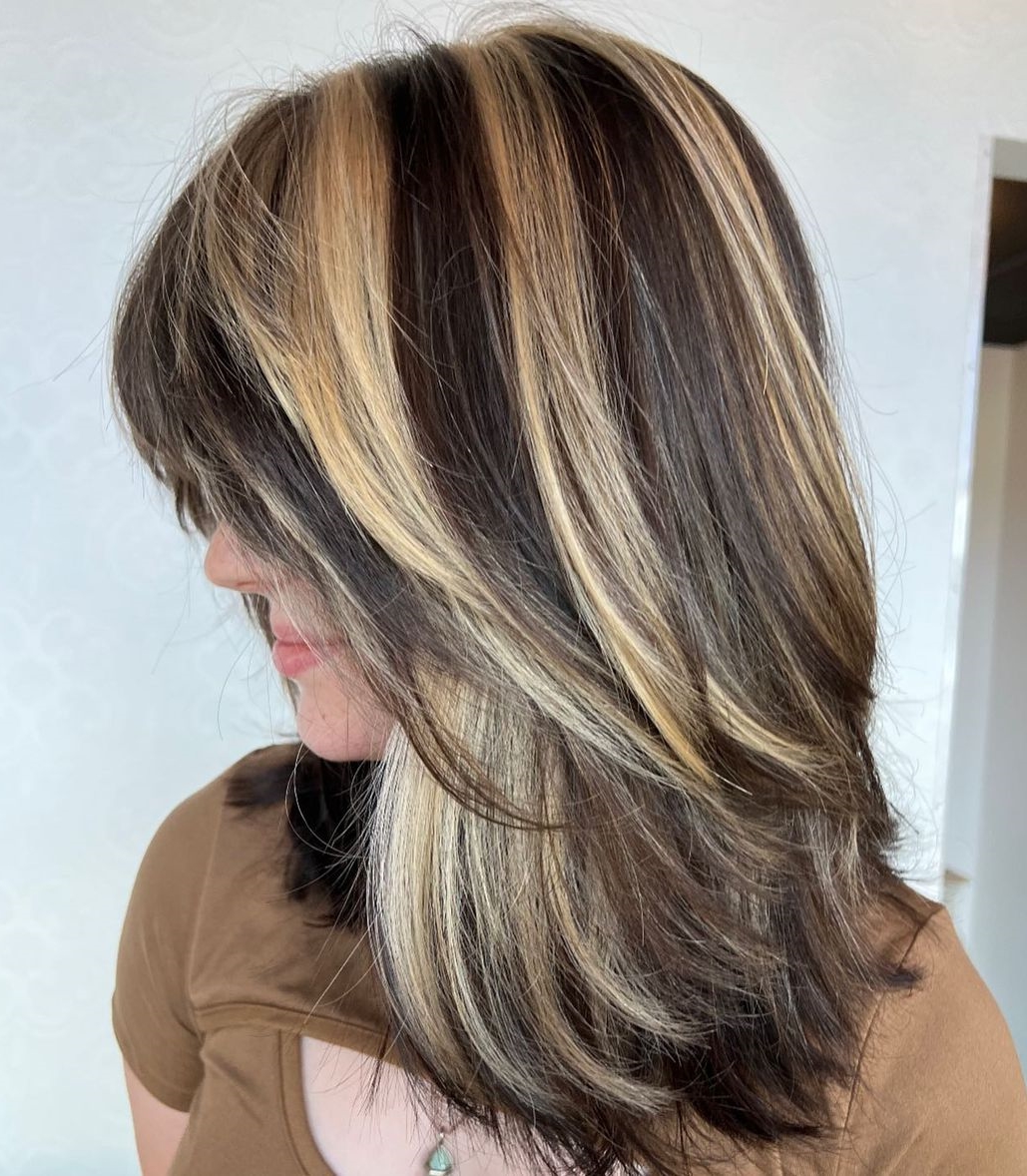 streaked blonde highlights on dark brown hair