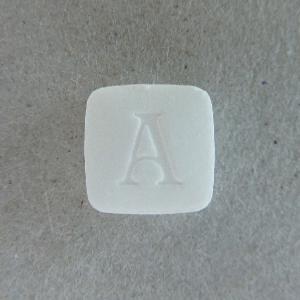 white square pill with a on it