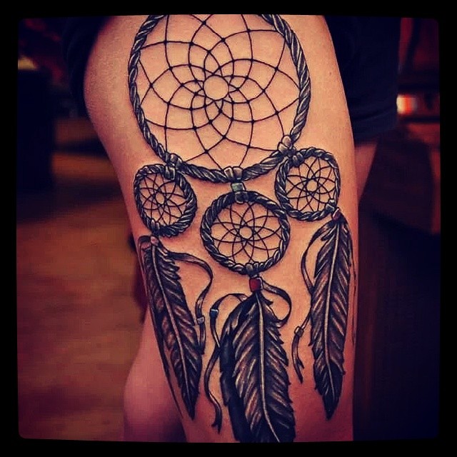 dream catcher tattoo on thigh