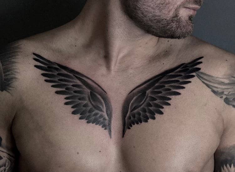 small wings tattoo on chest