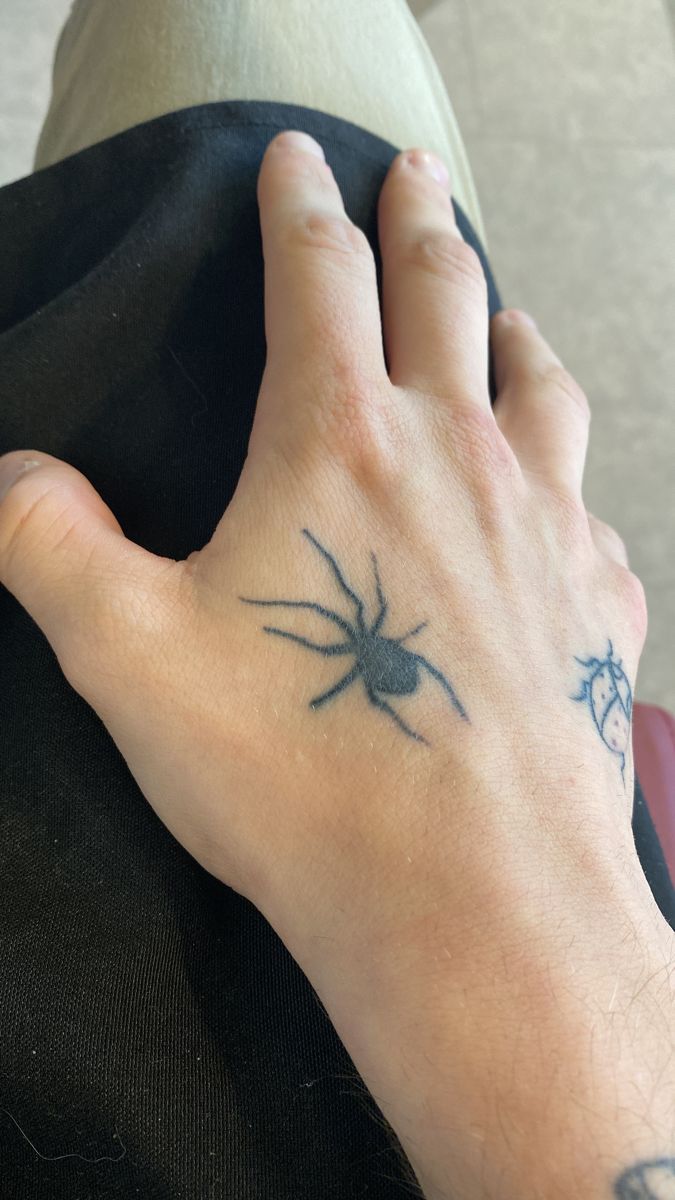 spider tattoo on hand