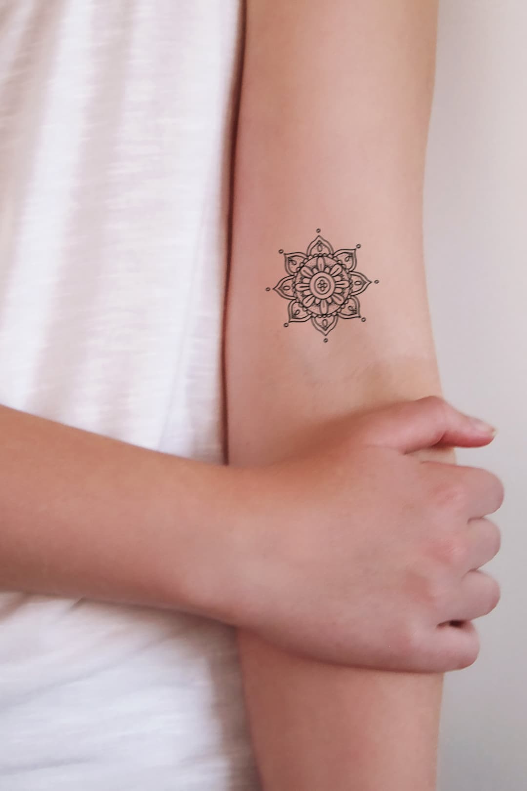 small mandala tattoo