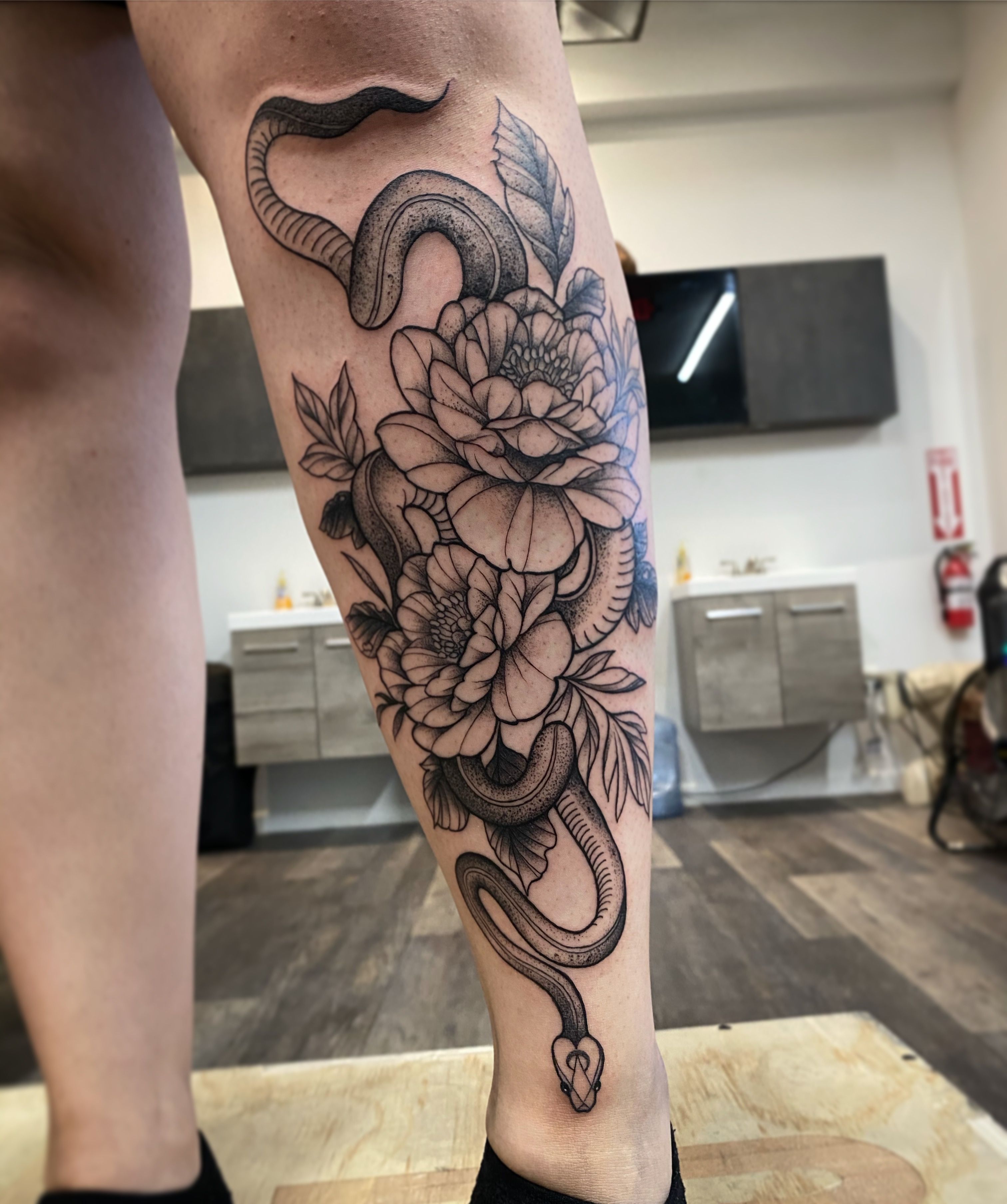 floral snake tattoo