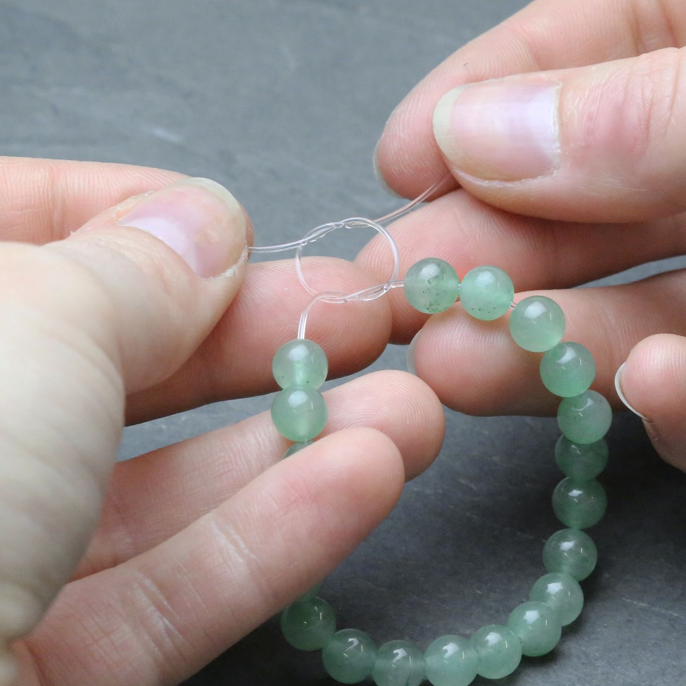 how to tie a clear string bracelet