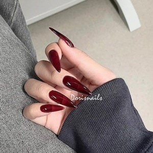 pointed red nails